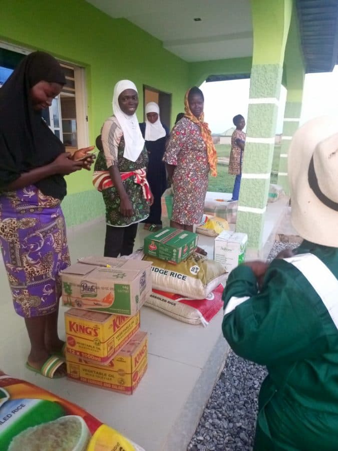 Women waiting to receive food supplies